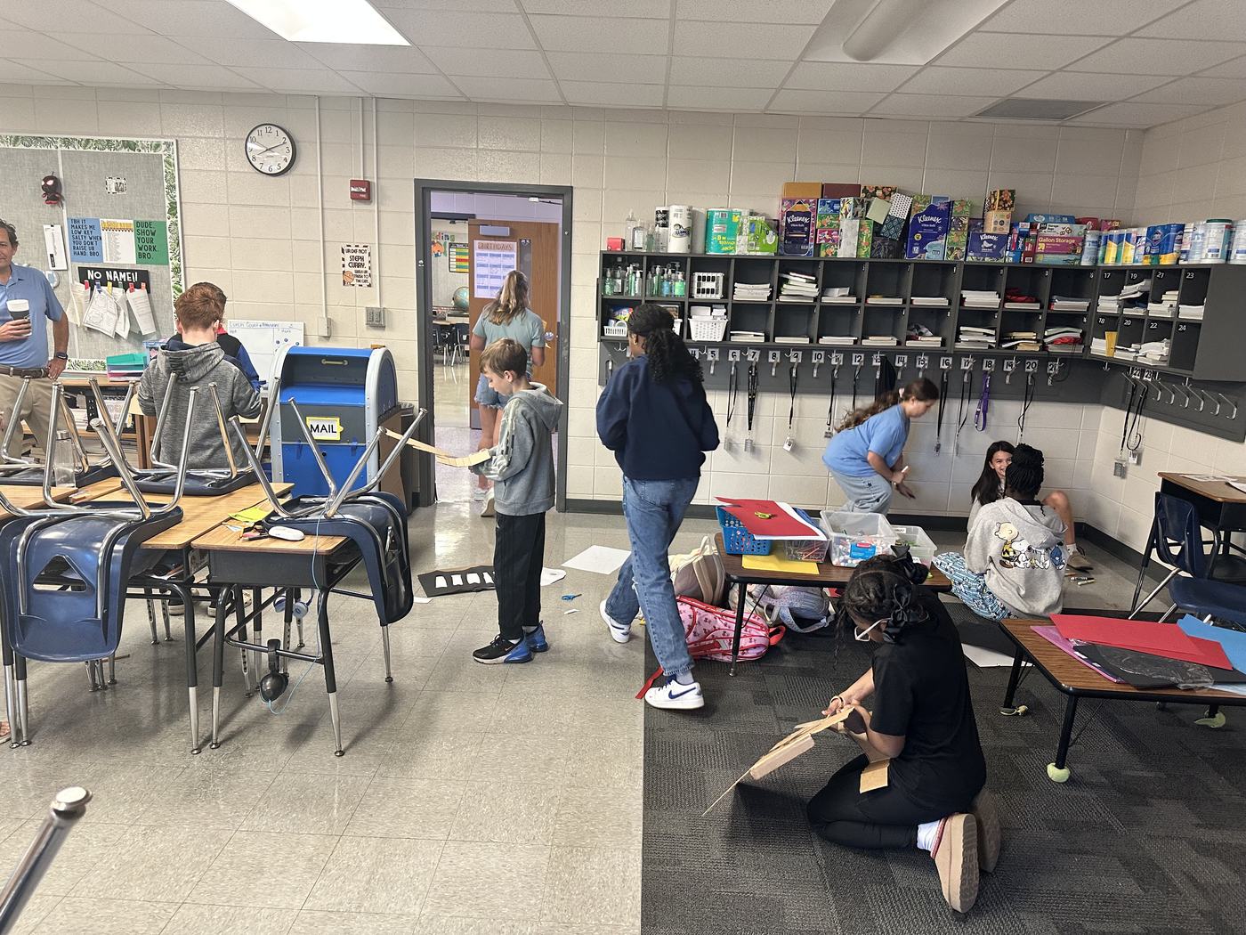 A Croninger Elementary classroom early in the morning, students moving between desks and cubbies as the day gets started.